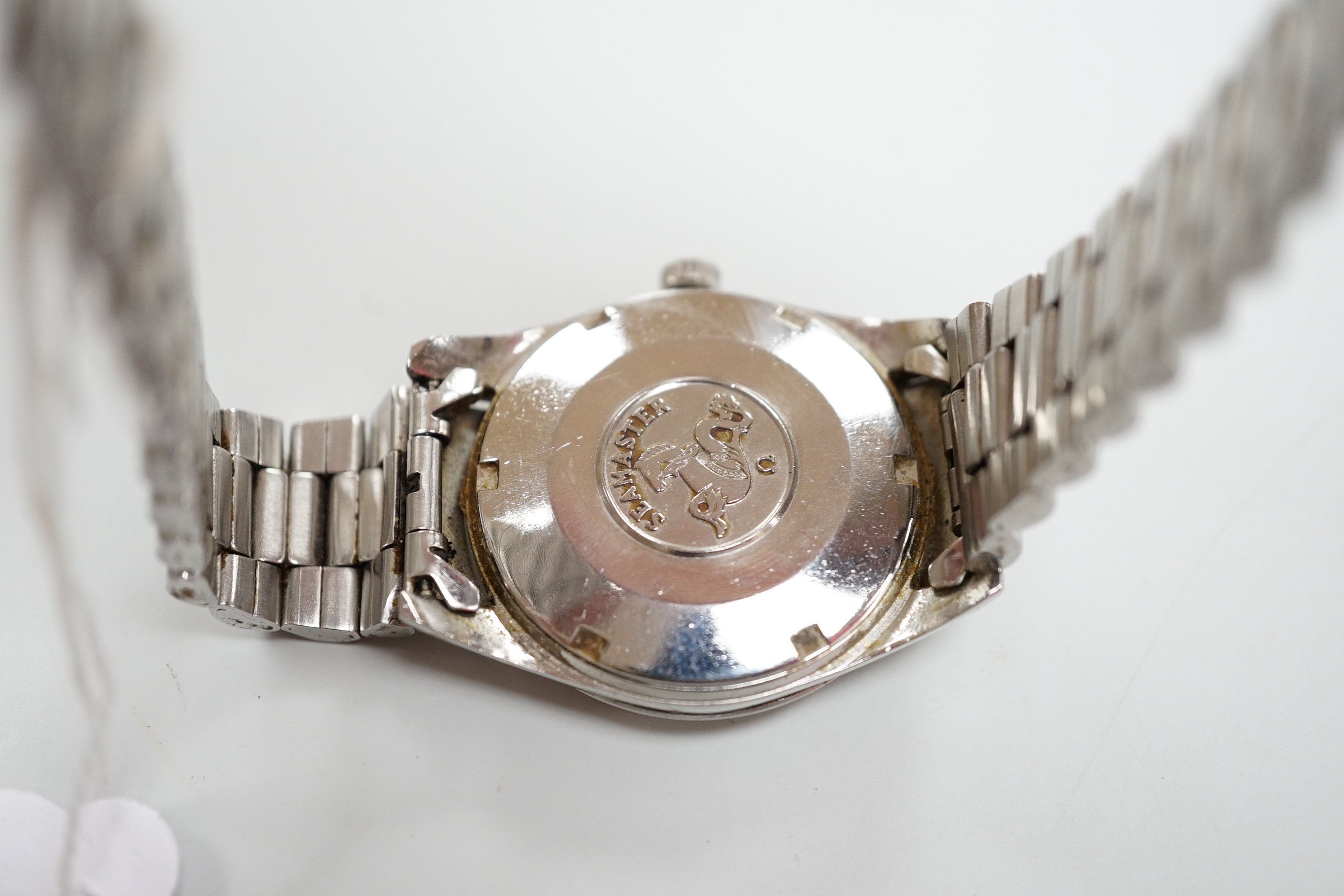 A gentleman's steel Omega Automatic Seamaster wrist watch, with baton numerals, centre seconds and date aperture, diameter 3.5cm